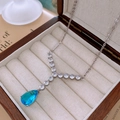 Detailed macro view of a blue teardrop zircon pendant necklace in a velvet jewelry box - Necklace-Water Drop (HN4541) / Silver/Blue