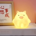 Cute cartoon pig night light with warm yellow glow and pink nose detail - Small Pig Night Light