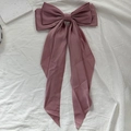 Elegant dusty rose satin bow hair clip with long ribbons on white textured fabric - Purple Pink