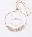 Pulsera ajustable de oro rosa con cinco circonitas azules cuadradas y engaste halo, de 25cm - Oro rosa