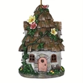 Detalle de casita de pájaros de jardín de hadas con techo de paja y flores - Estilo 5 Casita de Piedra con Puerta Rosa