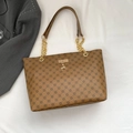 Brown tote bag with geometric pattern, gold chain strap and deer pendant on white fabric - Yellow