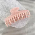 Pink acetate claw clip with marble texture and double row bone design on grey mat - 8.7cm / Floral Pink
