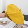 Detail of a bright yellow knitted wool beret showing its warm woven texture and 3D shape - M (56-58cm) / Yellow