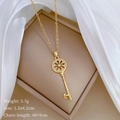 Detail of sunflower key pendant with micro diamonds on brown jewelry box with silk - Gold (C319 Stainless Steel Chain Copper Micro-inlaid Pendant)