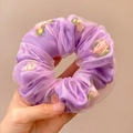 Purple organza scrunchie with pink satin roses and green leaves in hand closeup - Purple Flower Mesh Scrunchie