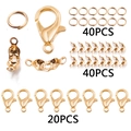 Golden DIY jewelry kit detail featuring lobster clasps, jump rings and crimp beads - KC Gold Set