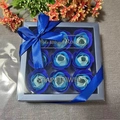 Close-up of blue rose soap flower gift box with 9 gradient roses and a satin ribbon - Blue Mix