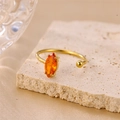 Elegant adjustable 18K gold ring featuring a marquise-cut orange zircon and gold bead accent - Orange