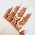 Bohemian gold butterfly ring set with geometric hollow designs on a hand - Butterfly Floral Gold Set (25231-gold)