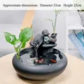 Ceramic tabletop fountain with a monk figure and golden fortune script, 33cm diameter - Blessing & Wealth - Black Round