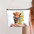 Portable highland cow print makeup bag with yellow floral design held by hand - Highland Cow in Flower Pot (jiayingpbb0100)