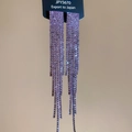 Detailed macro view of silver needle purple tassel earrings with sparkling rhinestones - Purple Square Tassel Style