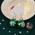 Festive green Christmas ball earrings with white snowflake patterns for holiday parties - Green Snowflake Ball