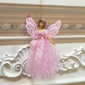 Detail of pink Christmas angel ornament with glittery resin body and lace fabric skirt - Pink