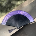 Purple and black gradient folding fan with floral patterns and a black tassel - Hollow Fireworks Purple Blue