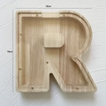 Letter R shaped wooden money box with natural oak grain and transparent acrylic cover - Letter R