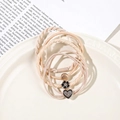 Detail of high-elasticity hair tie set featuring camellia flower and golden heart charms - 4Pcs Set - Heart Style / Beige