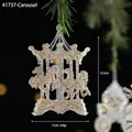 Golden glitter acrylic carousel ornament hanging on a pine branch for Christmas decor - Carousel
