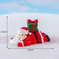 Miniature resin Santa Claus figurine with gift box on snow, size 4.6cm x 2.5cm - No.13 Lying Santa Claus