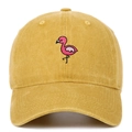 Close-up of pink flamingo embroidery on a yellow vintage washed cotton baseball cap - Adjustable / Yellow