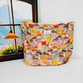 Detail of floral canvas tote bag showing colorful house patterns and textured fabric - Colorful Houses