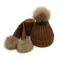 Detailed view of the brown chunky knit winter set with soft faux fur pom-poms on white background - Khaki
