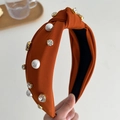 Orange fabric knotted headband featuring elegant white pearls and sparkling rhinestones - Tan