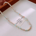 Floral ceramic beaded necklace with light blue and peach marble beads and gold accents - Light Blue Orange Pink/Marble Texture