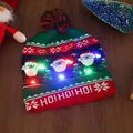 LED Christmas knit hat with Santa pattern, HO! HO! HO! text and mixed color pompom - Three Santa Figures
