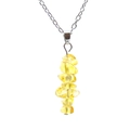 Detailed view of handmade necklace featuring raw yellow agate stones on a silver chain - Citrine