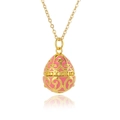 Detailed close-up of pink and gold enamel egg pendant on a delicate gold chain necklace - Pink