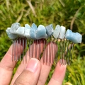 Handmade silver hair comb with light blue irregular raw crystal stones on green grass - Aquamarine Silver Comb Silver Wire