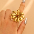 Close-up of a large 18K gold-plated flower ring with a center brownish-red gemstone - Ruby Large Flower (9818)