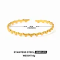 Polished 18k gold plated stainless steel open bangle featuring a minimalist dot pattern - Gold Polka Dot Style