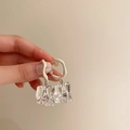 Detail showing irregular frosted acrylic hoops with transparent geometric drop pendants - Matte Hoop Ice Cube Style / White