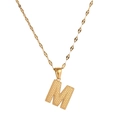 Detailed close-up of golden letter M pendant with dotted texture on a sleek chain - Letter M