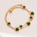 Gold double-layer bracelet featuring emerald green star and heart shaped stones - Star Heart Style