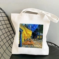 White canvas tote bag featuring Van Gogh Cafe Terrace at Night print on a black chair - Café Terrace at Night (STD525-N)
