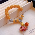 Ethnic yellow beaded bracelet with silver spacers and colorful tassel in a jewelry box - Colored Tassel Flat Round: Single Color Hair Crystal Tassel Bracelet