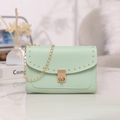 Mint green leather crossbody bag with gold rivet studs and chain strap detail - Green