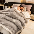 Grey quilted flannel blanket with thick sherpa fleece lining for warmth and comfort - Light Grey + White Lamb Cashmere