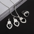 Silver-toned jewelry set featuring black heart-shaped gemstones and crystal accents - Necklace Earrings Ring Set / Black