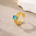 Gold plated stainless steel triple band ring with lake blue zircon stone centerpiece - Gold-Blue Zirconia (Round)