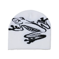 Detail shot of white knitted beanie featuring black frog art embroidery and fine texture - White