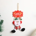 Decorazione natalizia Babbo Natale in peluche con scritta Merry Christmas su muro bianco - Babbo Natale
