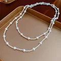 French vintage long pearl necklace for women featuring layered beads in elegant retro style - White