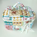 Quilted cotton makeup bag with cute cartoon patches and ribbon zipper on light background - Patchwork Flower Girl