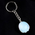 Blue opal cat paw keychain with silver ring on black background for couples - Opalite (Synthetic)