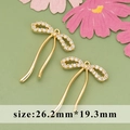 Gold plated ribbon bow pendant with white zircon crystals, sized 26.2mm by 19.3mm - ME5610A - Gold Bow Knot - 1pc